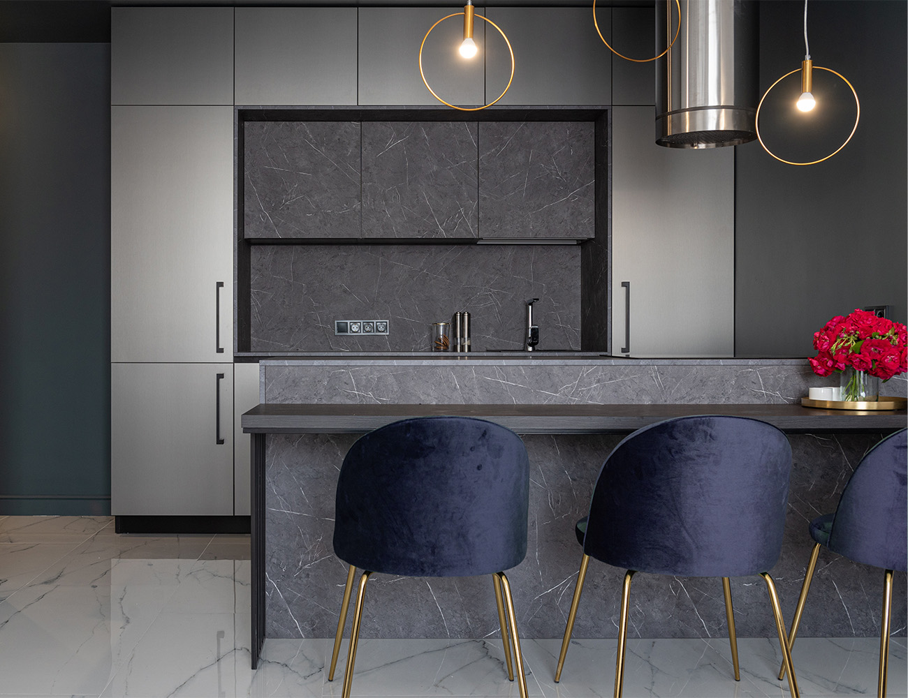 Modern kitchen with marble island and gold pendant lights