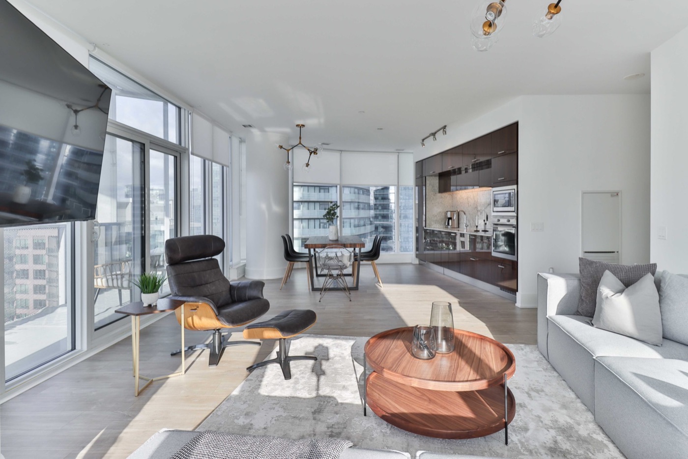 Bright, professionally staged condo living room photographed for a listing